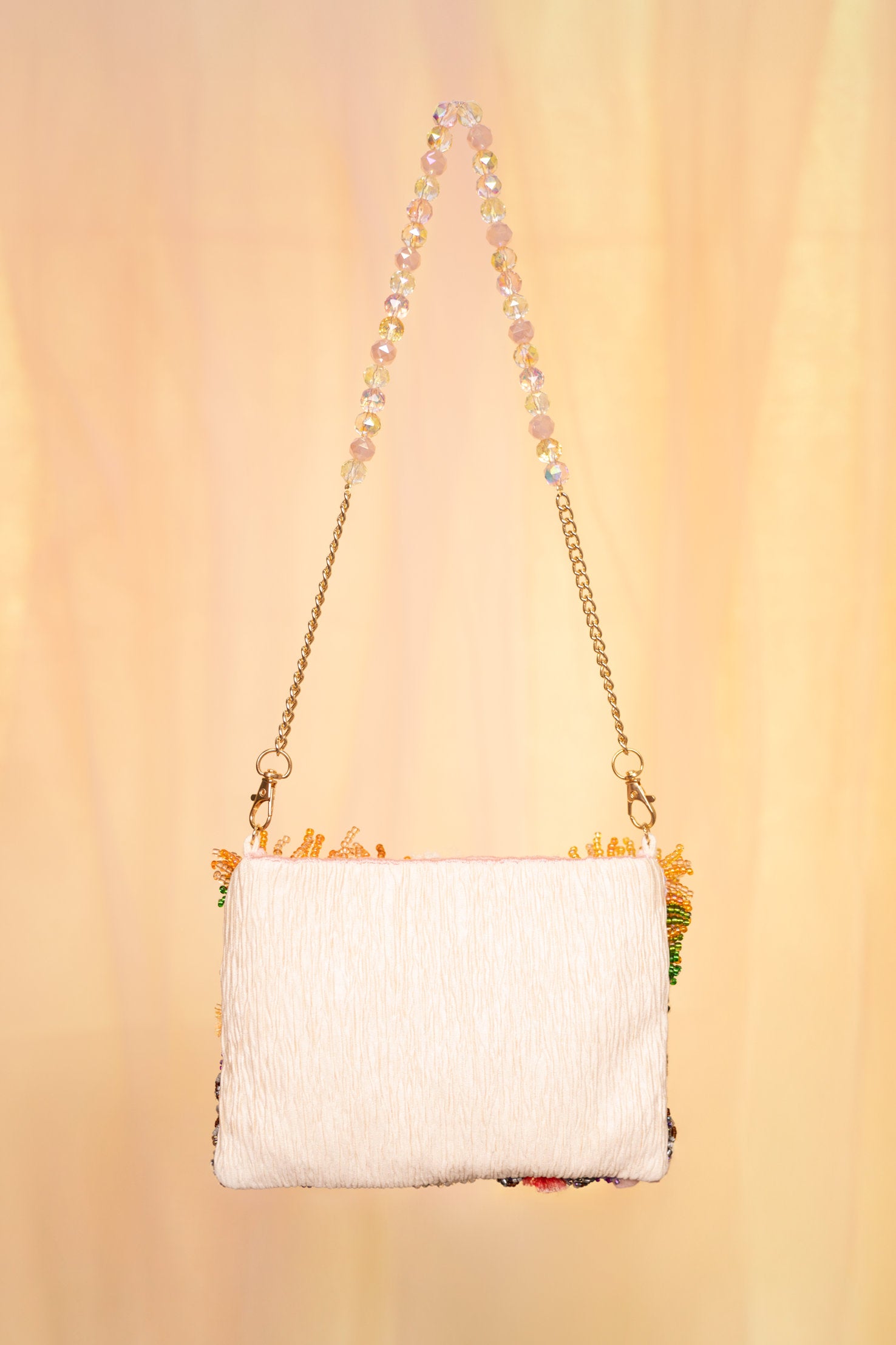 Hand-embroidered floral art bag with beaded handle and chain strap