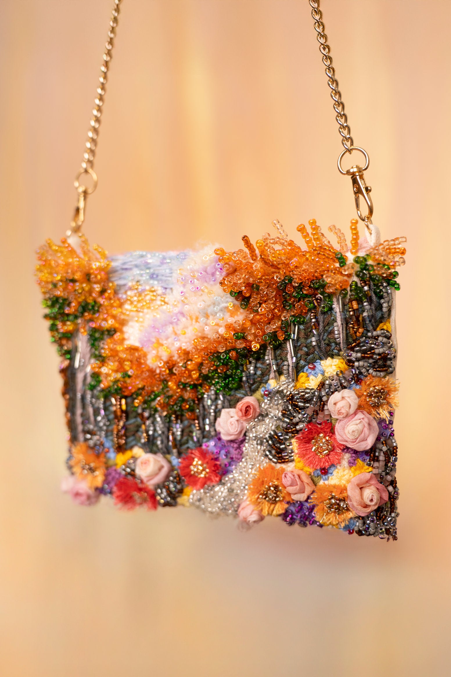 Hand-embroidered floral art bag with beaded handle and chain strap