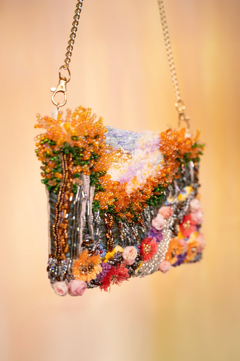 Hand-embroidered floral art bag with beaded handle and chain strap