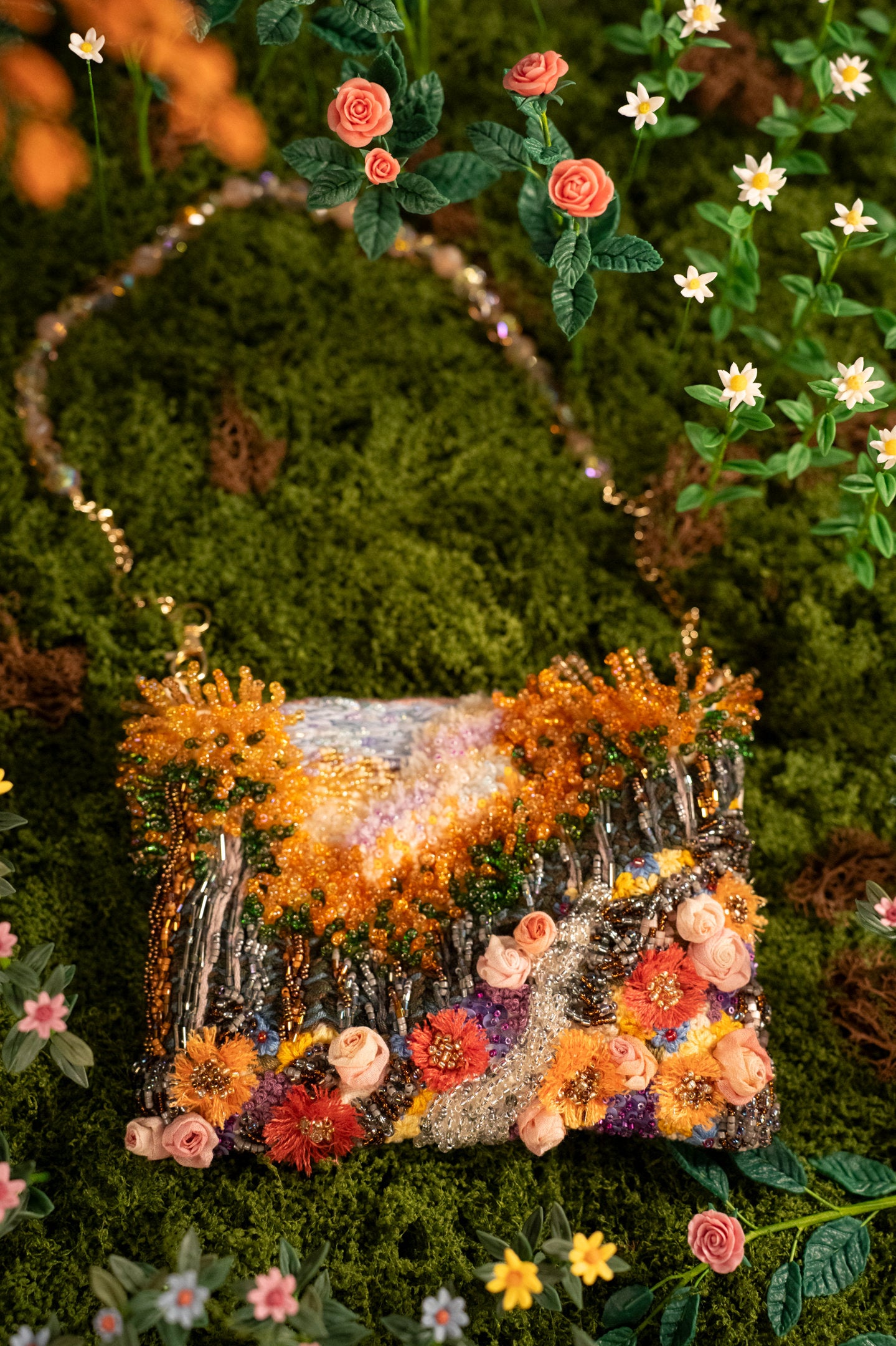 Hand-embroidered floral art bag with beaded handle and chain strap