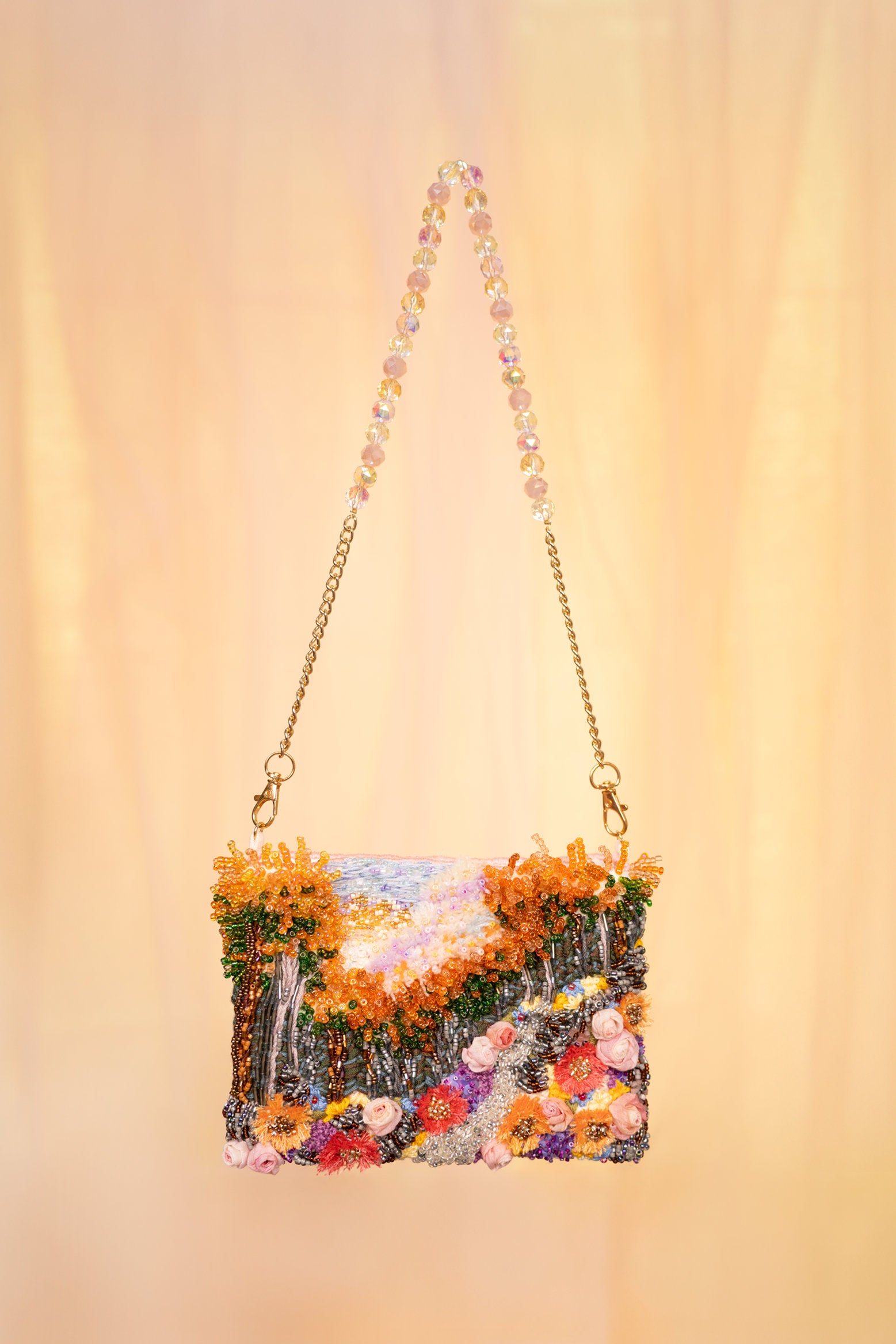 Hand-embroidered floral art bag with beaded handle and chain strap